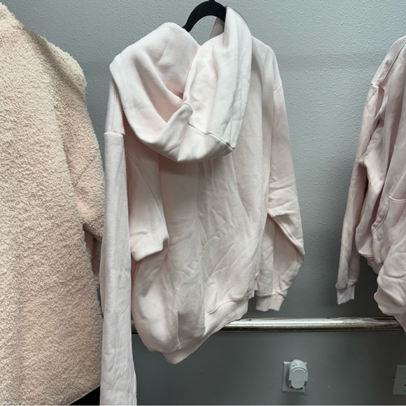 SKIMS Skims Cotton Fleece Classic Zip Up Hoodie in Barely Pink - Picture 4 of 4